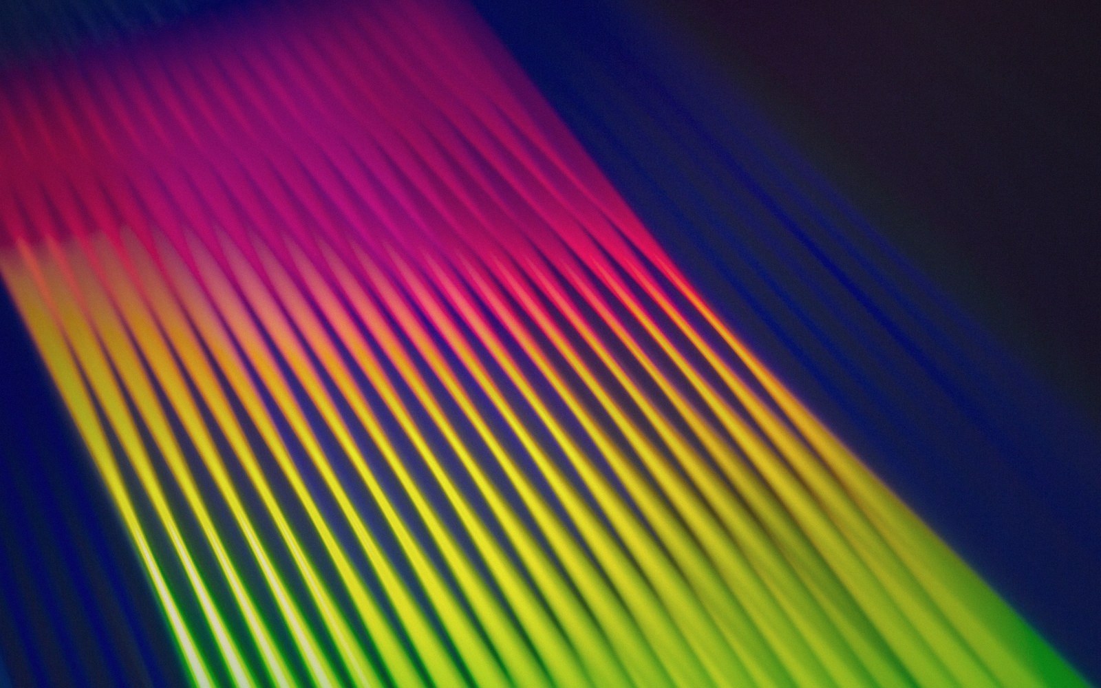 Diagonal parallel lines shift from pink and magenta to yellow and green